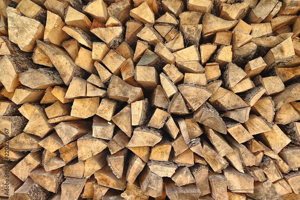 Firewood background. Preparation of firewood for the winter Firewood background. Preparation of firewood for the winter