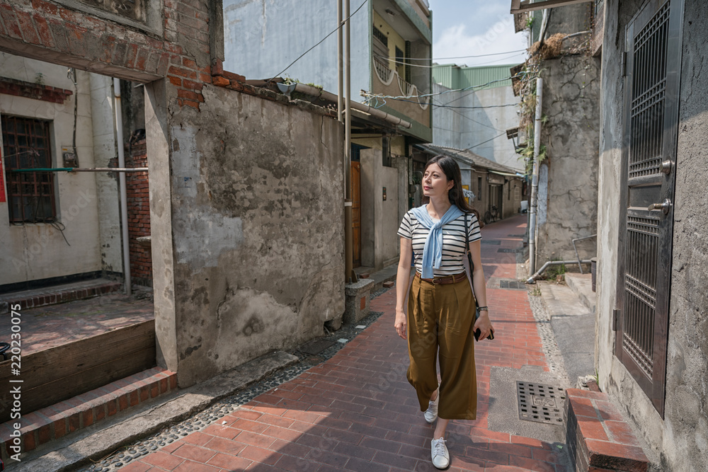 beautiful woman walking in the old street. beautiful woman walking in the old street.