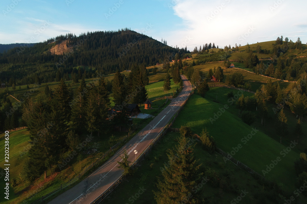 Fototapeta premium Aerial landscape of the mountain road, at sunrise