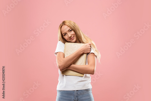 Businesswoman with laptop. Love to computer concept. Attractive female half-length front portrait, trendy studio backgroud. Young emotional woman. Human emotions, facial expression concept.