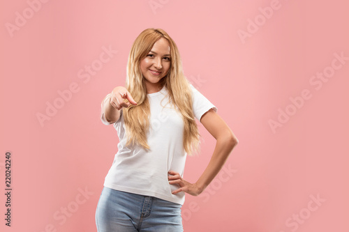 I choose you and order. The smiling business woman point you, want you, half length closeup portrait on studio background. The human emotions, facial expression concept. Front view. Trendy colors