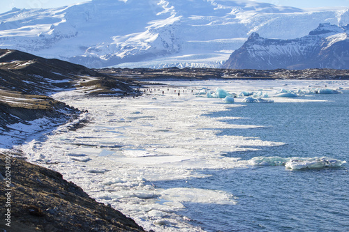 Beautiful cold winter landscape with icebergs in Jökulsárlón glacial lagoon, Vatnajökull National Park, southeast of Iceland, Europe. photo