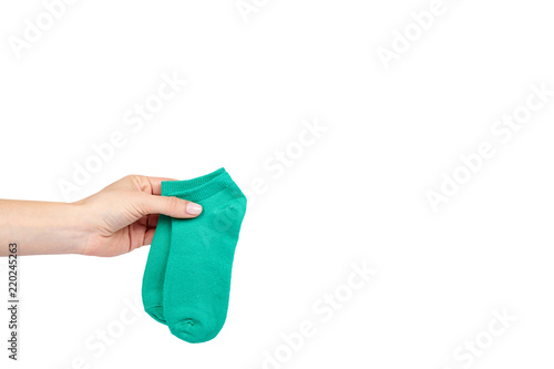 Cotton kid sock with hand isolated on white background, copy space template