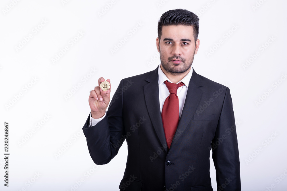 Businessman holding golden bitcoin isolated. Businessman holding golden bitcoin isolated.