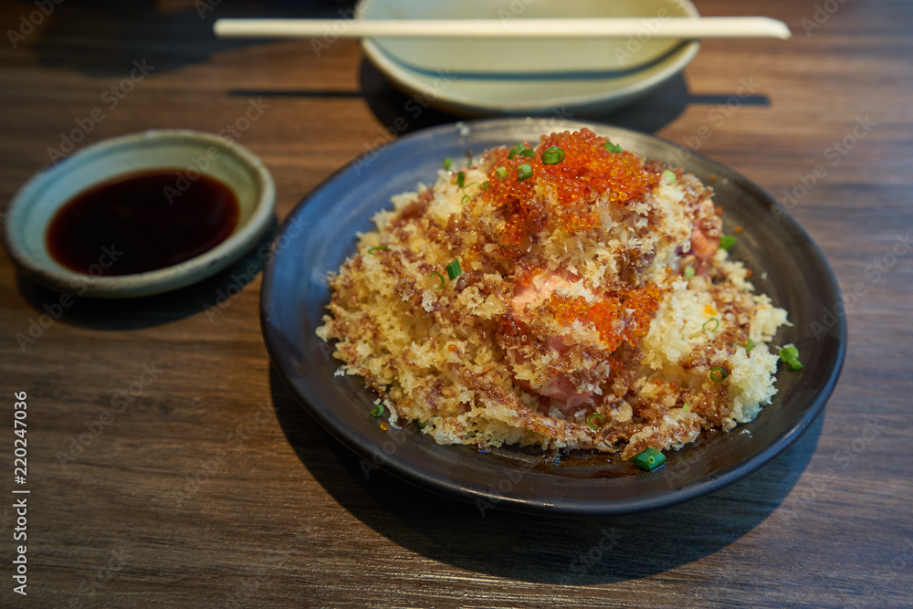 salmon crunchy crispy spicy source with ebi egg on top salmon crunchy crispy spicy source with ebi egg on top