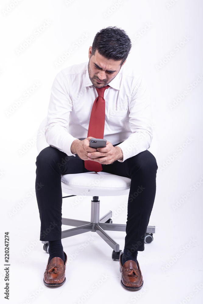 Businessman sitting on white chair isolated. Businessman sitting on white chair isolated.