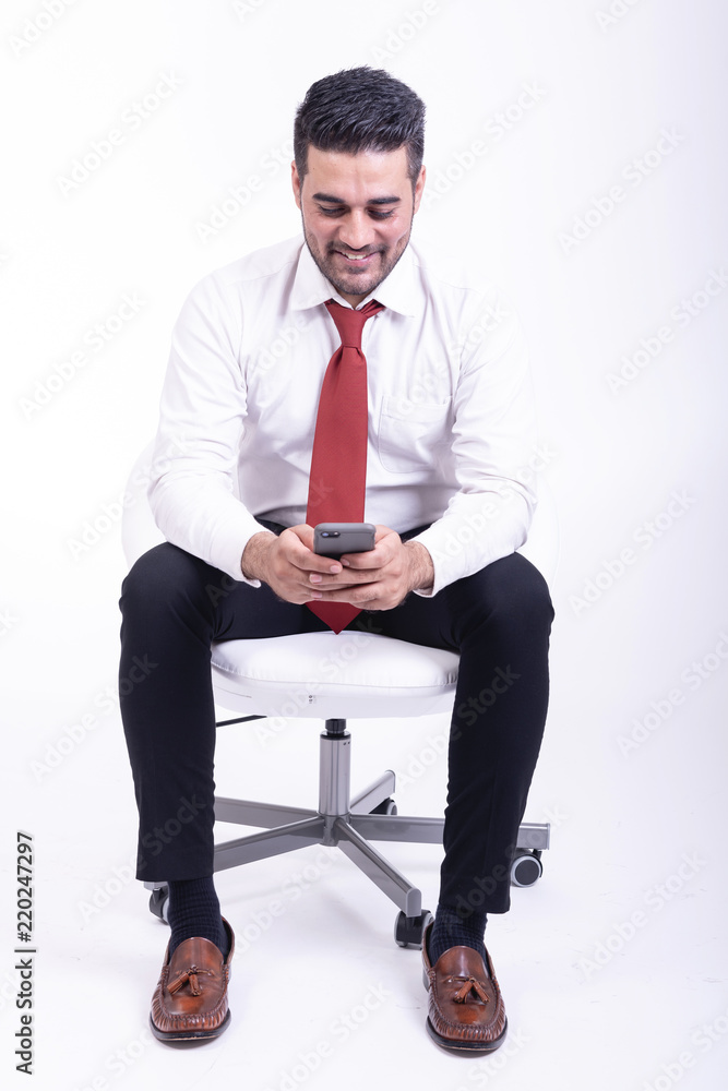Businessman sitting on white chair isolated. Businessman sitting on white chair isolated.