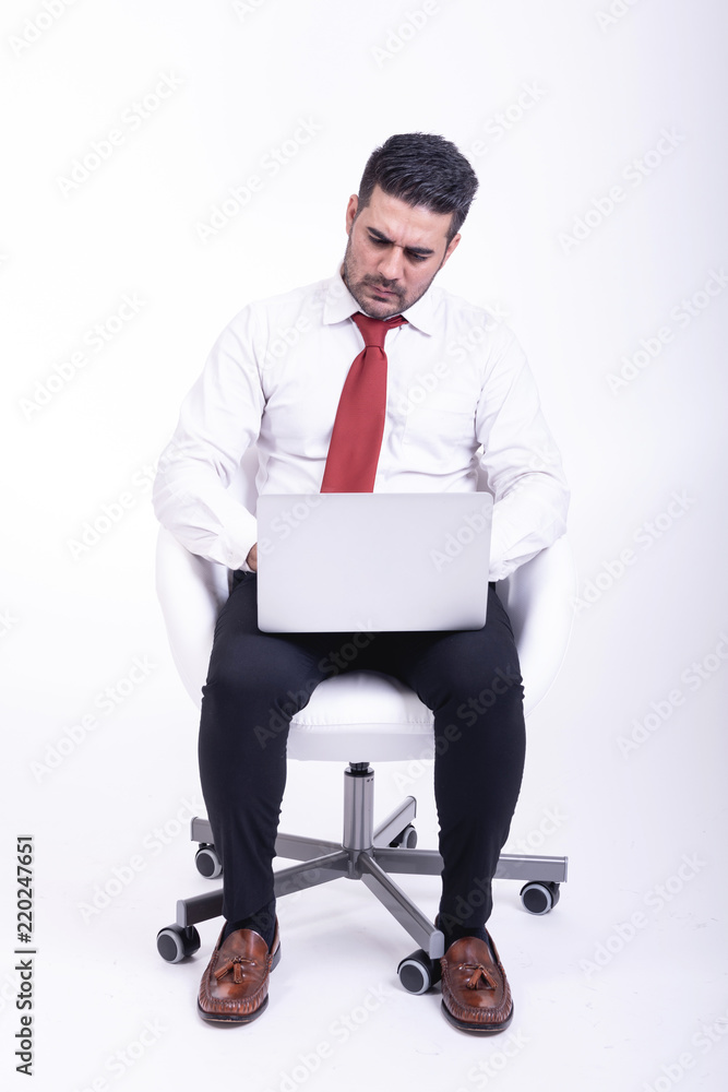Businessman sitting on white chair isolated. Businessman sitting on white chair isolated.