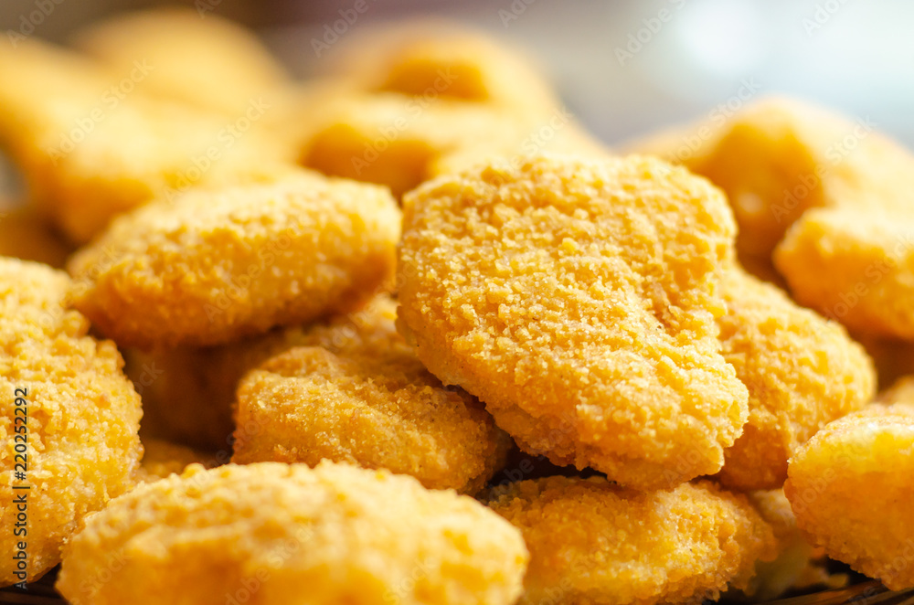 Golden deep fried chicken nuggets, fast snacks Golden deep fried chicken nuggets, fast snacks