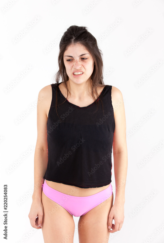 Contempt emotional girl on a light background Contempt emotional girl on a light background