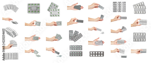 Fotografie set of different Silver blister packs pills with hand isolated on white background