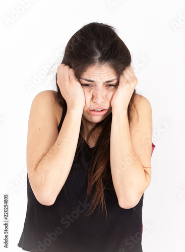 Fear emotional girl on a light background photo