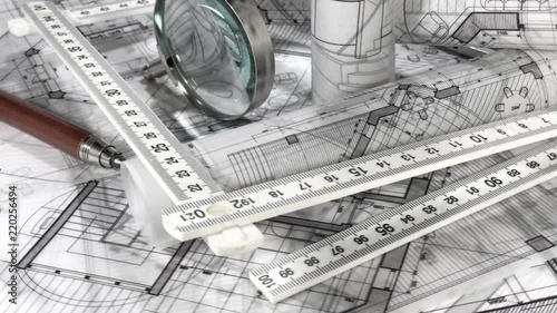 Wallpaper Mural Blueprints - rolls of architectural drawings, loupe - magnifying glass and compasses smoothly rotate on the surface of the architectural plan of a modern house Torontodigital.ca