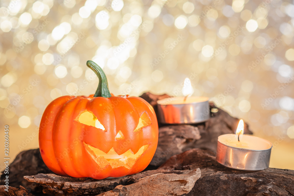 close-up of halloween pumpkin decorate with candles on wooden timber, beautiful bokeh background, soft focus close-up of halloween pumpkin decorate with candles on wooden timber, beautiful bokeh background, soft focus