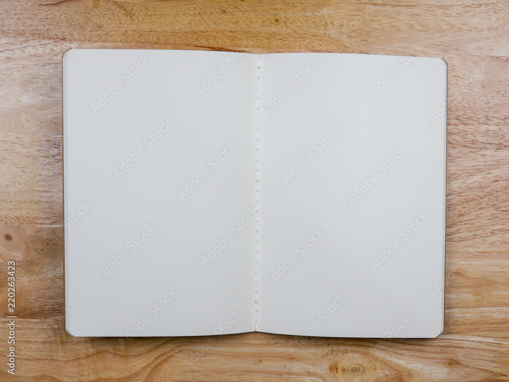 Recycled paper book on wooden background Recycled paper book on wooden background