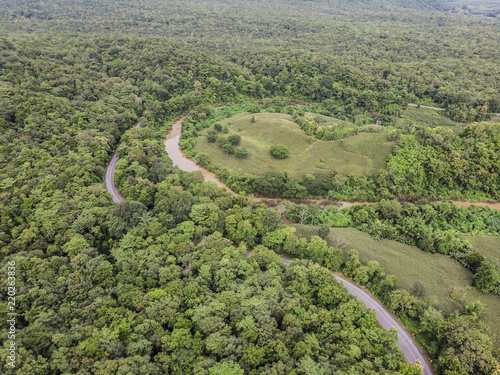 Path through the green forest and countryside of Thailand, Top view aerial photo from drone.