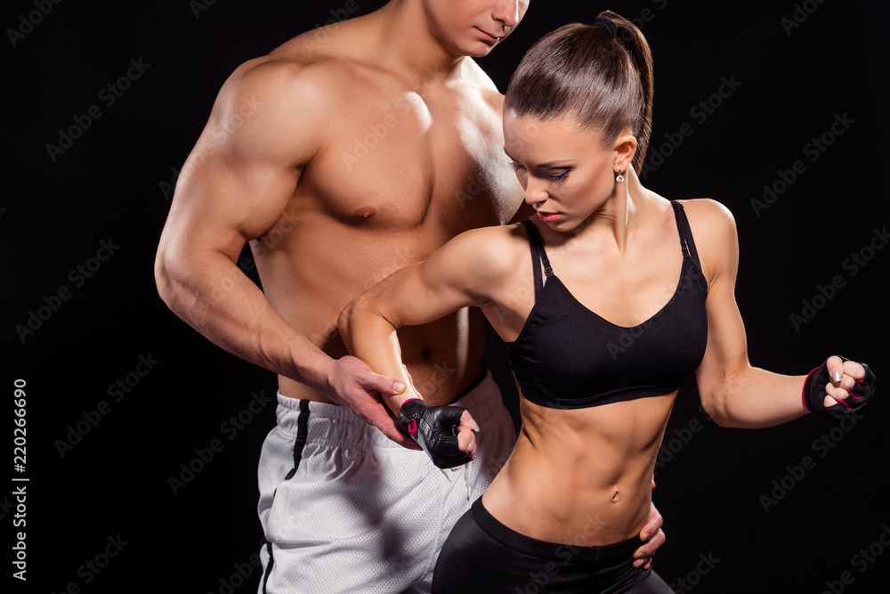 Muscular man near posing model.