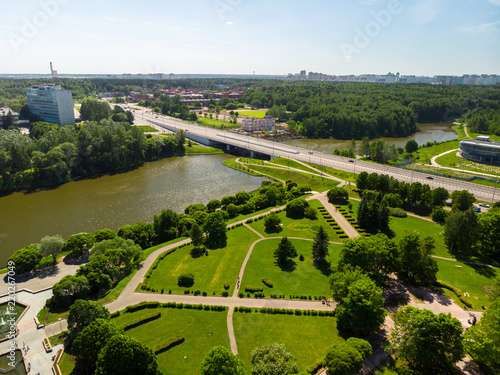 Bridge across large city pond and Victory Park in Zelenograd Russia.