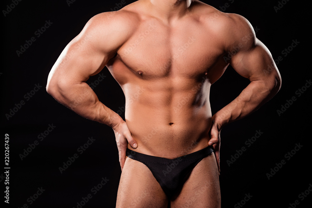 Fototapeta premium Muscular bodybuilder's big torso.