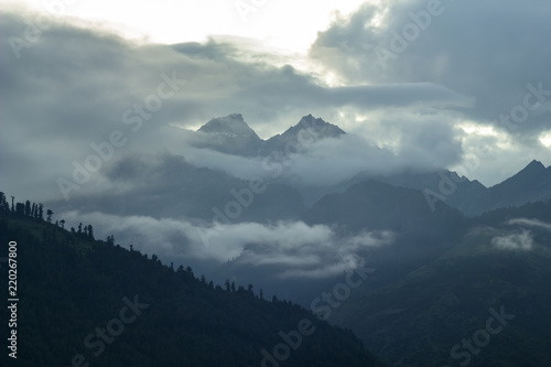 dark heavy cloud on the peak mountains