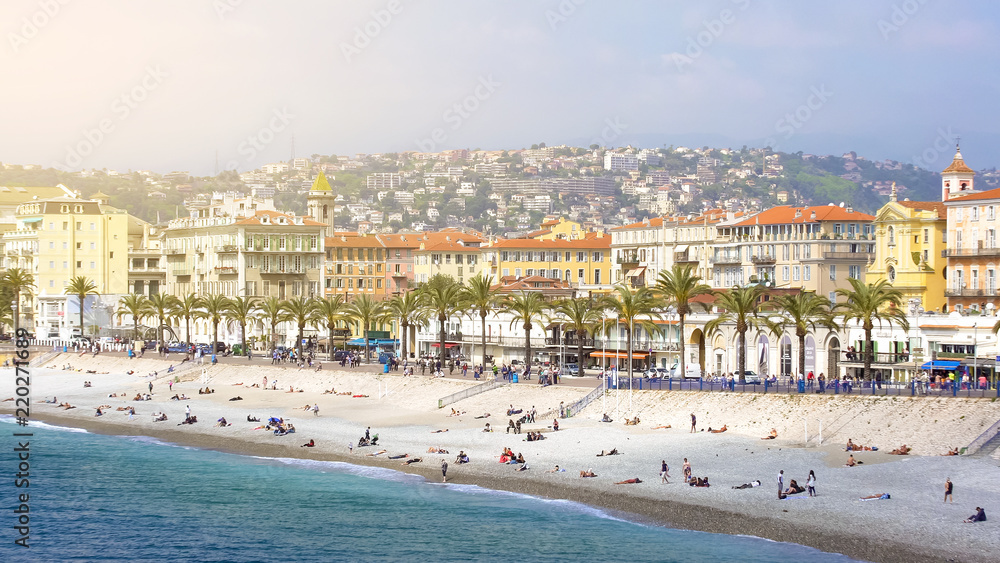 Summer holidays in Nice, people sunbathing on summer beach, sunny resort city