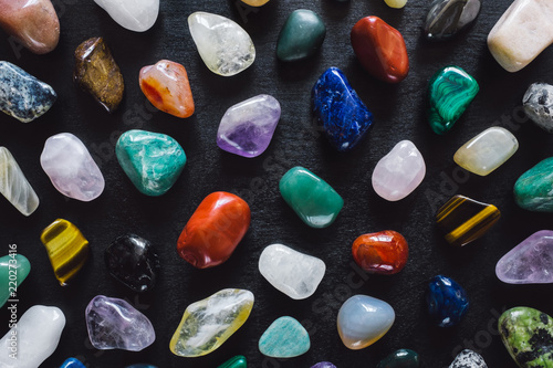 Mixed Polished Stones on Black Table photo