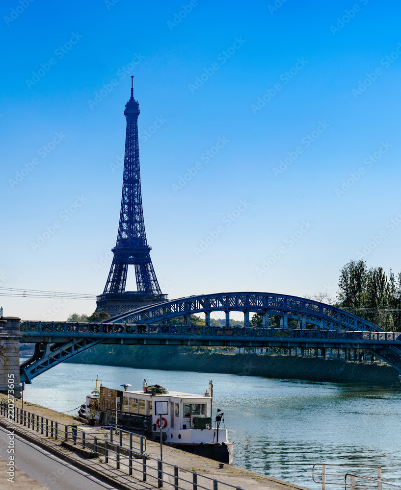 Eiffel Tower and Bridge Rouelle over Seine River in Paris, France