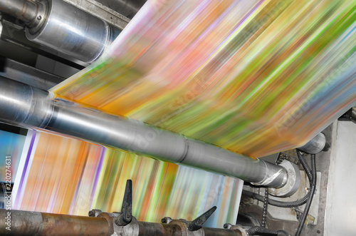 Printing machine Roll paper in motion prints magazine, newspapaer photo