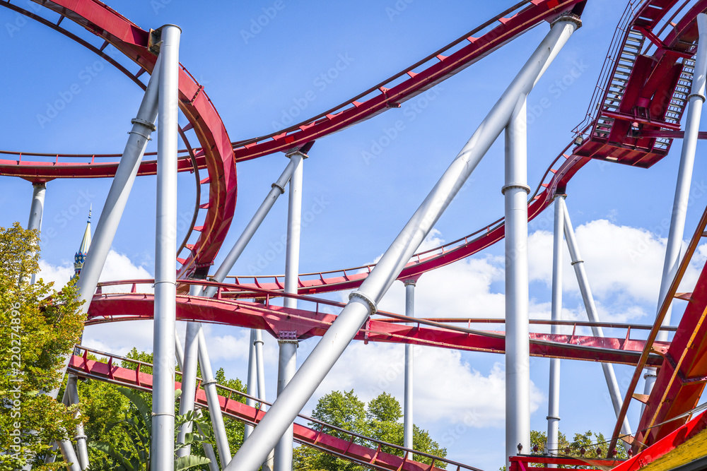 Rollercoaster in red colors with curves and loops
