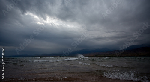 Stone in the water, Mountain lake, Issyk-Kul, Kyrgyzstan