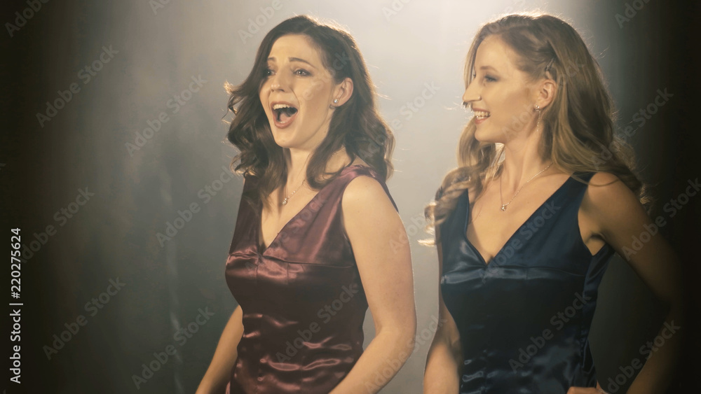 Two Beautiful opera singer girl. 4k Portrait close up of the artist singer. Two Beautiful opera singer girl. 4k Portrait close up of the artist singer.