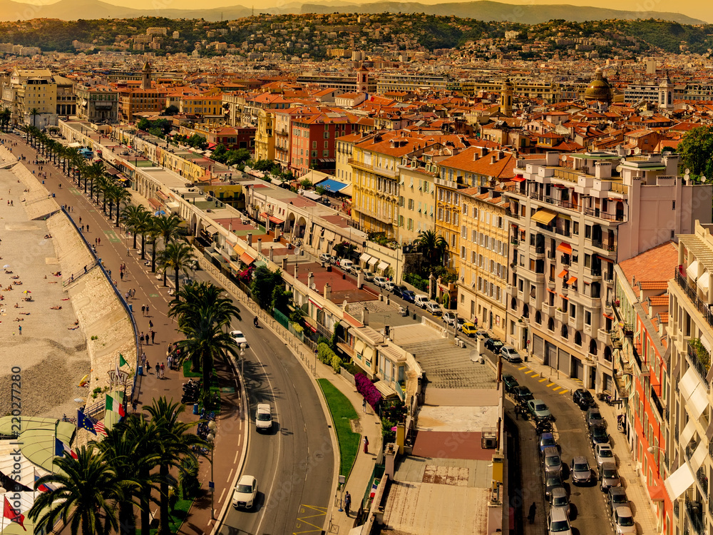 Fototapeta premium Nice, France - 05 May, 2015: Famous Promenade in Nice, France at sunset