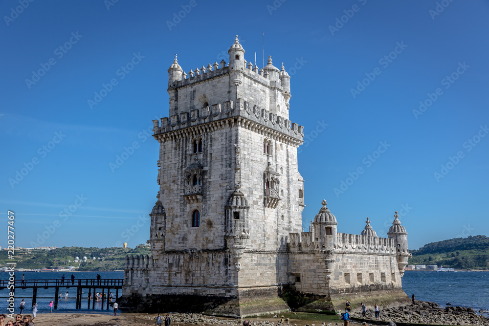 Lisbon, Portugal - May 8th 2018 - Tourists and locals enjoying a blue sky afternoon in the Belem Tower, heritage site of Unesco in Lisbon, Portugal