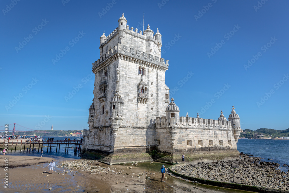 Lisbon, Portugal - May 8th 2018 - Tourists and locals enjoying a blue sky afternoon in the Belem Tower, heritage site of Unesco in Lisbon, Portugal