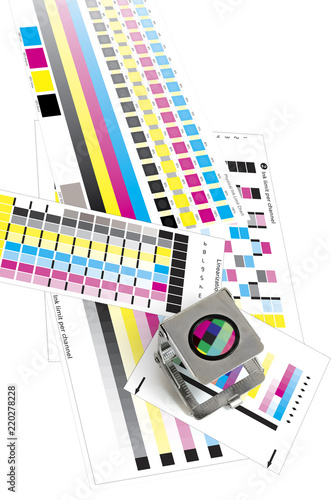 Фотография Shallow depth of field image of a printers loupe on printed sheet