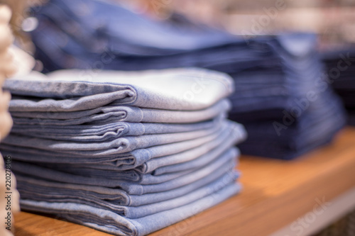 Shopping sale background theme. Jeans clothes on hanger in shop.