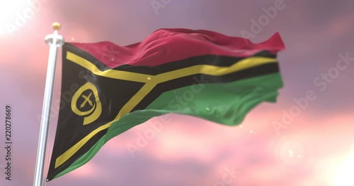 Flag of Vanuatu waving at wind in slow at sunset, loop photo