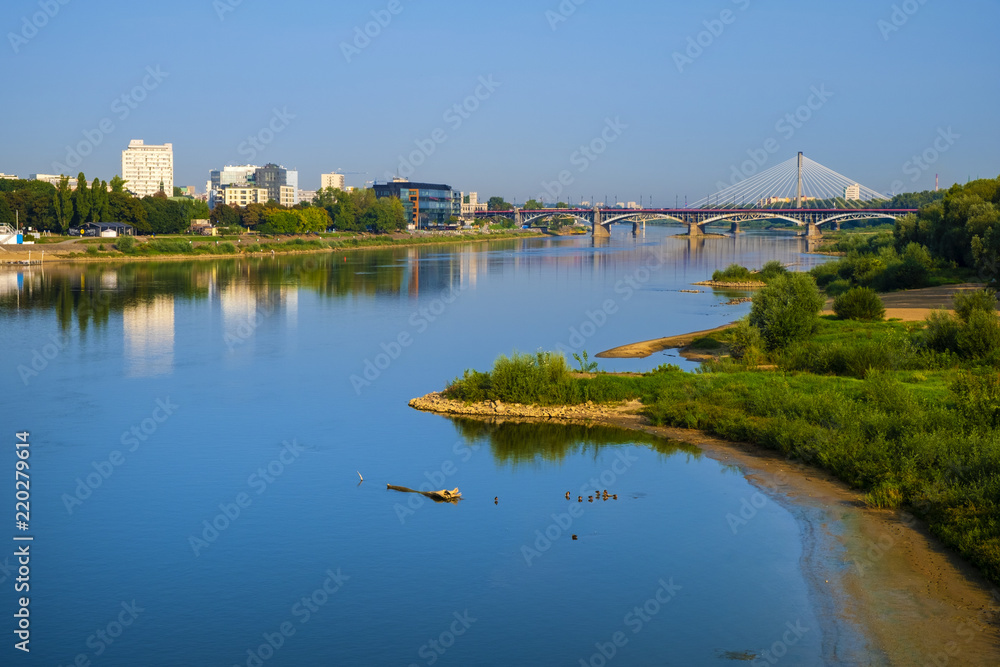 Warsaw, Poland - Panoramic view of the Poniatowskiego bridge and Swietokrzyski bridge across the Vistula river with Warsaw city center in background