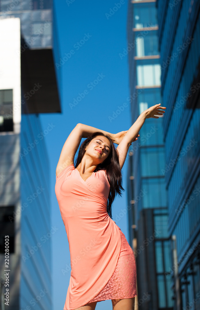 Beautiful brunette woman in sexy pink dress Beautiful brunette woman in sexy pink dress