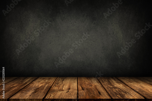 wooden table with grey wall background photo