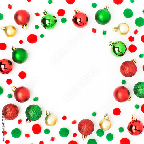Frame made of red and green Christmas balls on white background. Flat lay, top view