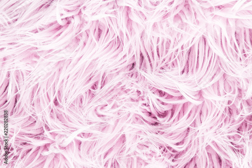 Pink fluffy fur background. Flat lay, top view