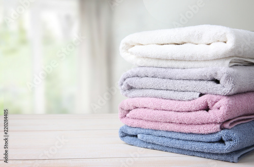 Towels stack on table empty space background.