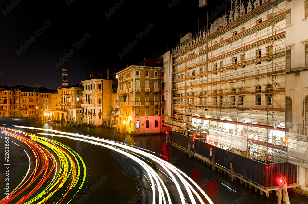 NIght view with light trails of Canal Grande from famous Rialto Bridge in Venice
