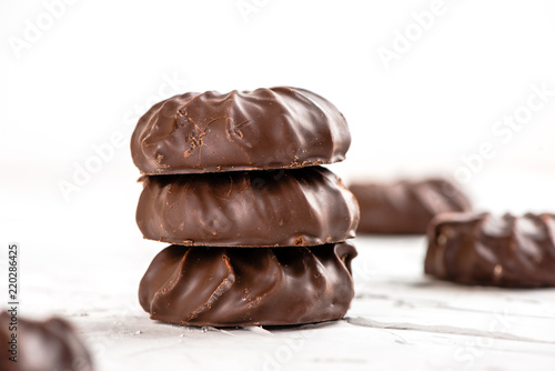dark chocolate-coated zefir view isolated on white background food dessert photo