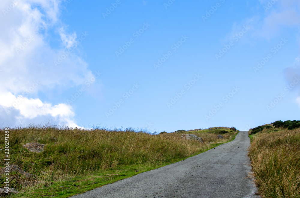 A country road under a blue sky. Photo taken in Snowdonia, Wales A country road under a blue sky. Photo taken in Snowdonia, Wales