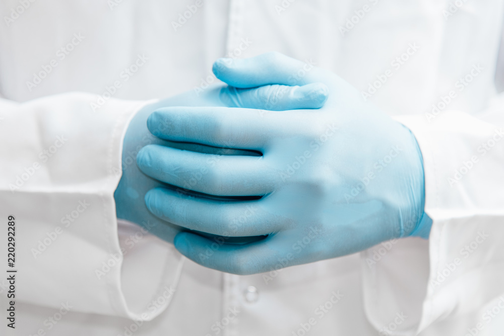 Relax hand doctor. Man hand in blue gloves. Relax hand doctor. Man hand in blue gloves.