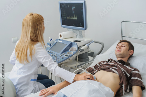 Doctor examination a man at abdomen Usg