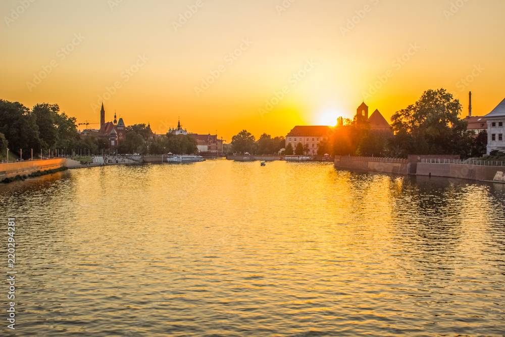 old small city with boat on the river in sunset evening time