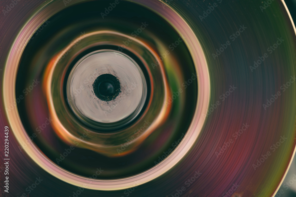 Part of rotating mechanism close-up. Brutal auto part in pink tone with gold shine. Colorful bckground of metal device. Part of rotating mechanism close-up. Brutal auto part in pink tone with gold shine. Colorful bckground of metal device.